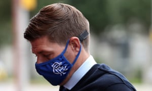 Rangers manager Steven Gerrard, wearing a face mask, arrives.