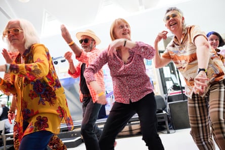 A group of older men and women dancing together