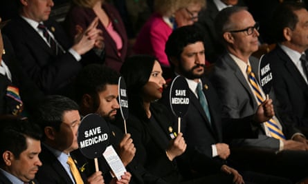 Democratic lawmakers protest as Trump speaks during an address to a joint session of Congress.