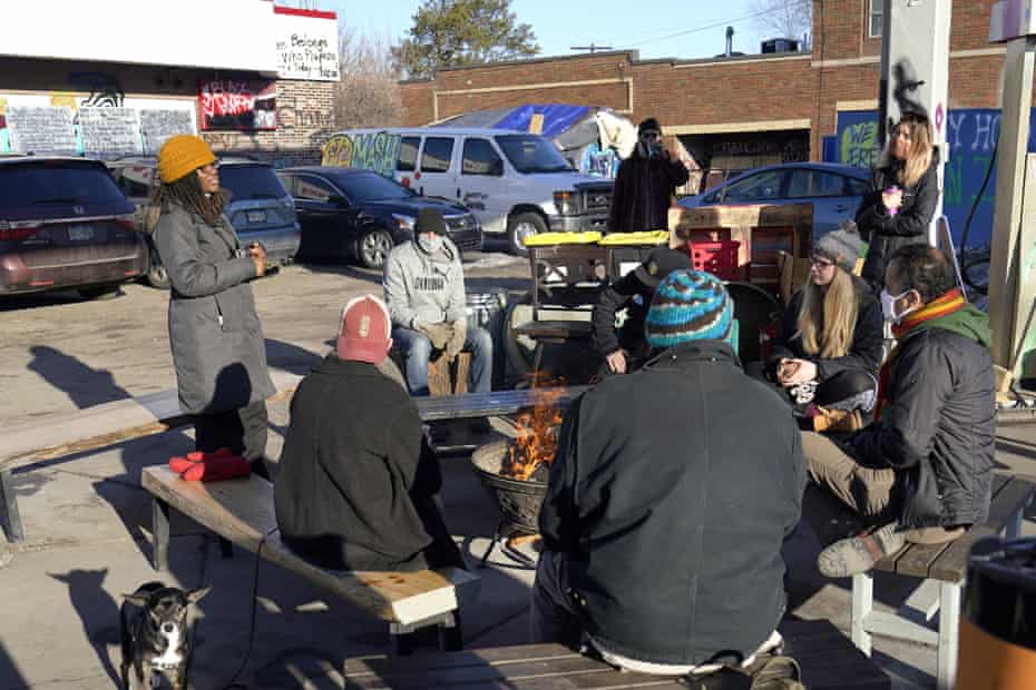 Marcia Howard, left, a group organizer, addresses activists and neighbors at George Floyd Square on 4 March.