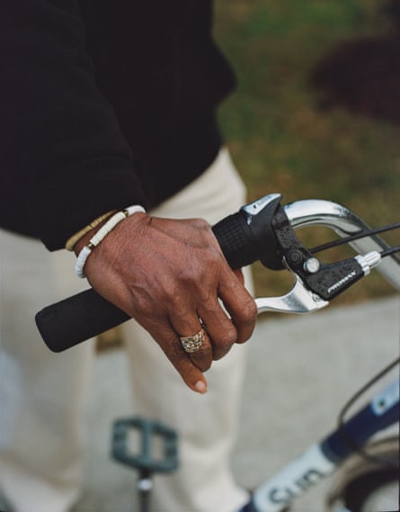 a woman’s hand on the handlebar of a bike