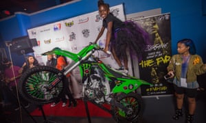 A girl poses for a picture on the red carpet