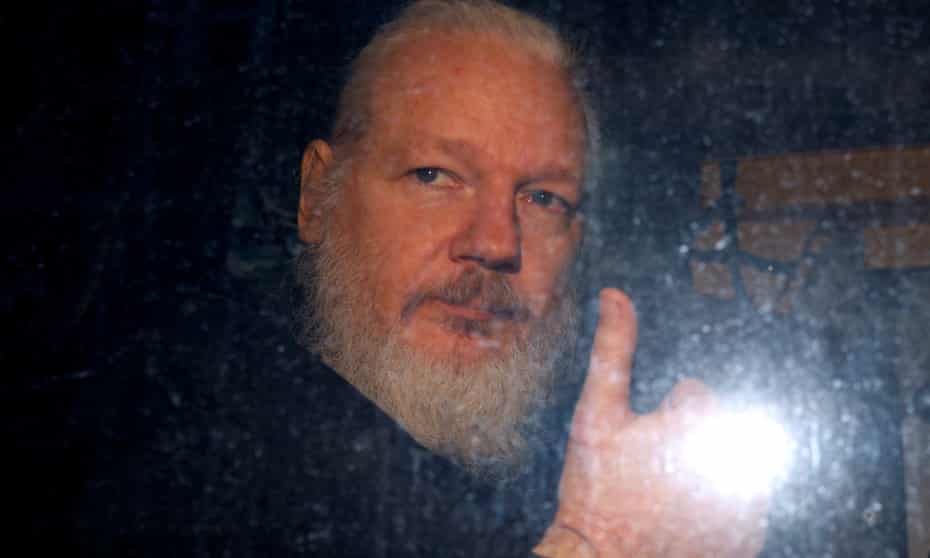 Julian Assange leaves a police station in London in April 2019