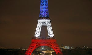 The Eiffel Tower is lit with the blue, white and red colours of the French flag to pay tribute to the victims of the Paris attacks