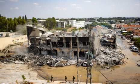 Israeli forces demolish a police station where Hamas militants were holed up in Sderot, southern Israel