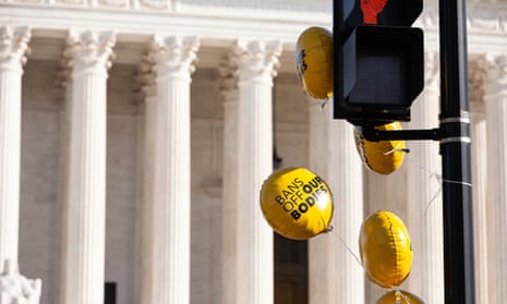 One of the many balloons at the Center for Reproductive Rights rally for abortion justice at the Supreme Court as the justices hear oral arguments in Dobbs v. Jackson Women's Health Organization. 