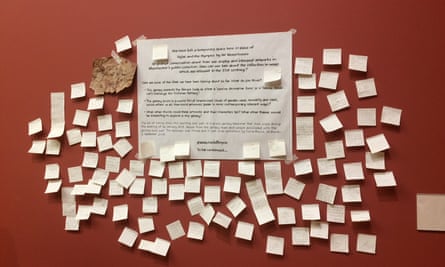 Comments left of Post-it notes in the space left when the painting was taken down.