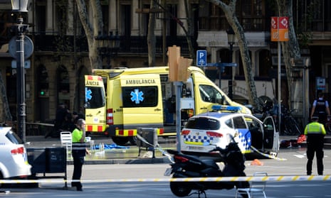 Emergency works attend the scene of the crash on Las Ramblas in Barcelona.