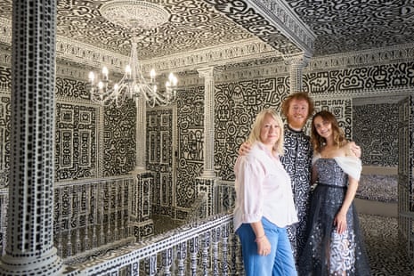 Mr Doodle, aka the artist Sam Cox, shot in his black and white doodled home, with his mother Andrea and wife Alena