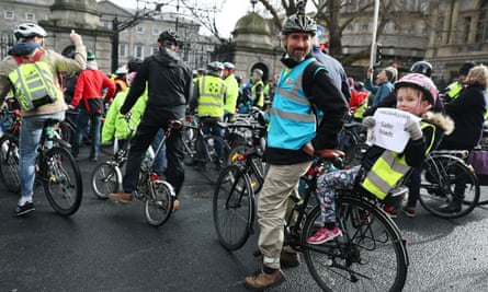 Jef Bucas and his daughter Lena protest outside Leinster House, Dublin, in 2017, calling for more of the transport budget to be allocated to cycling infrastructure.