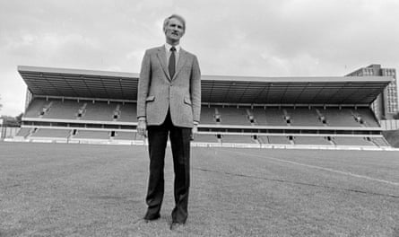 The Wolves chair Derek Dougan in front of the John Ireland Stand at Molineux in 1983