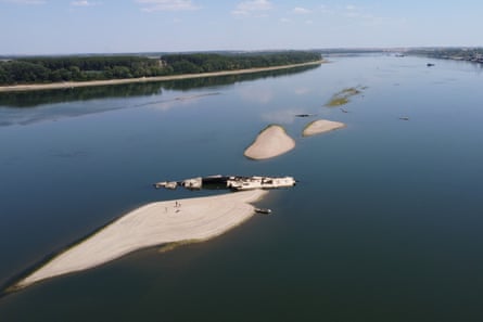 Aerial view of the second world war warship on its side within the lower water level of the Danube