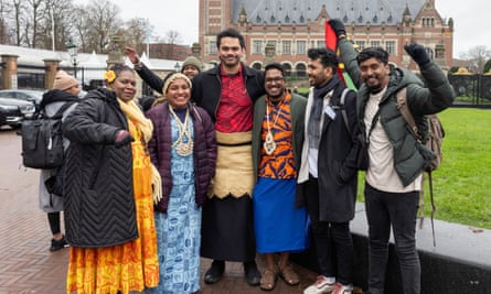 The group pose for a photo outside the court building.
