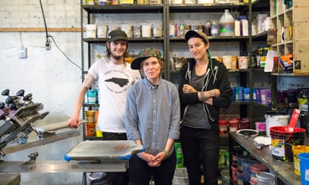Zach Allbritton, SB and Bernard Stephens stand in the workspace of Lightning Bolt Ink in Asheville, North Carolina, on Thursday.