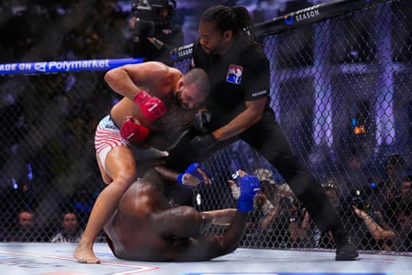 Josh Hokit strikes Derrick Lewis during their heavyweight fight on Sunday night at the White House.