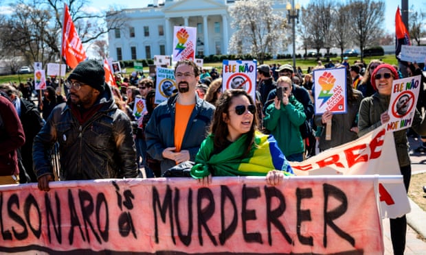 American and Brazilian activists protest against the upcoming visit of Brazilian president Jair Bolsonaro, before the White House.