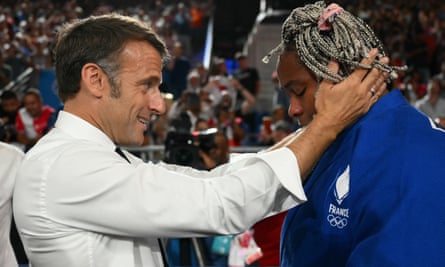France’s Romane Dicko is congratulated by Emmanuel Macron after winning bronze