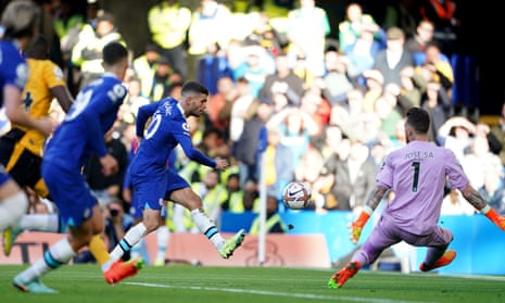 Christian Pulisic of Chelsea hits the ball over Wolverhampton goalkeeper Jose Sa to double the hosts' lead.