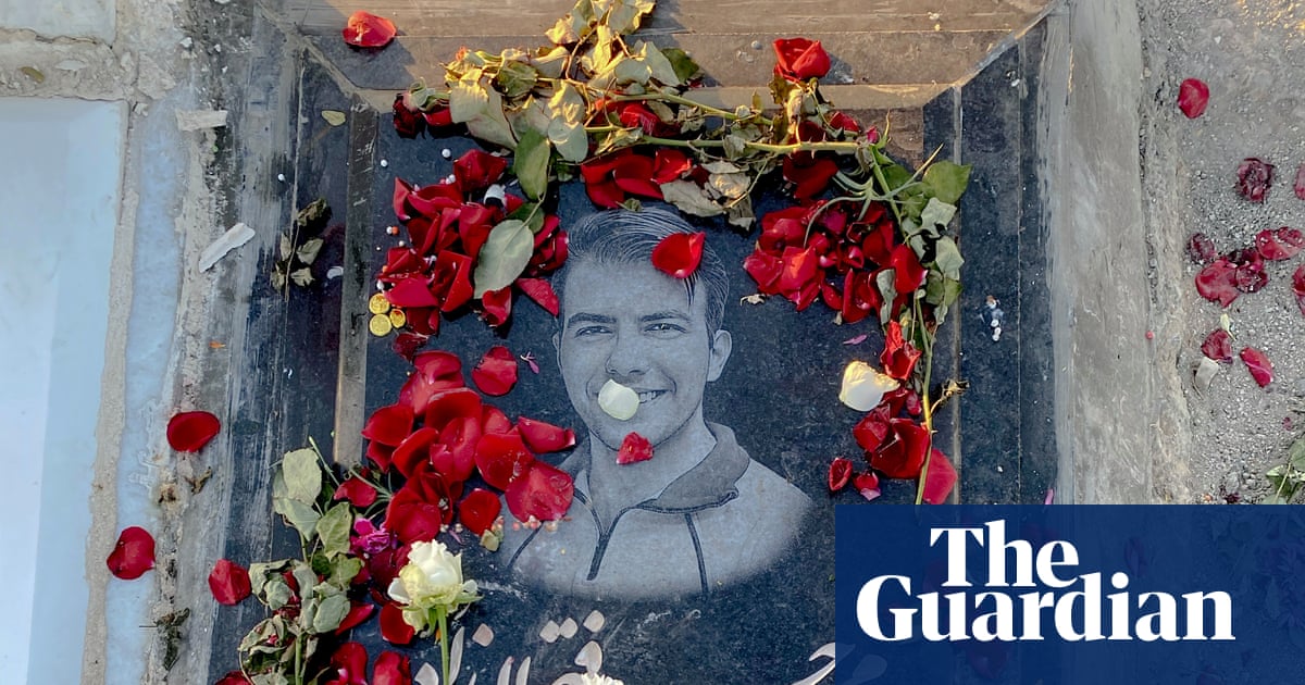 ‘They made us say he was a martyr’: families at Iran’s largest cemetery mourn those killed in the January protests