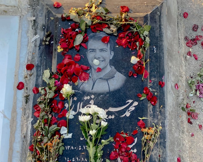 ‘They made us say he was a martyr’: families at Iran’s largest cemetery mourn those killed in the January protests