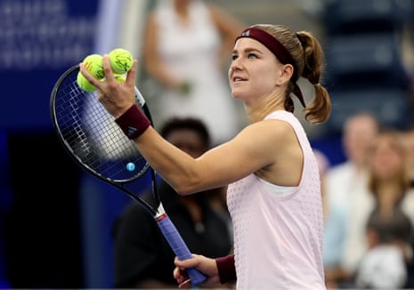 Karolina Muchova prepares to hit balls to fans after winning her second round match against Katie Boulter.