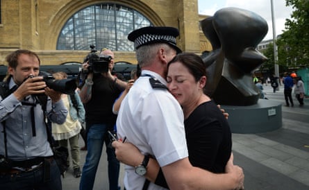 Gill Hicks hugs PC Andy Maxwell, who came to her aid.