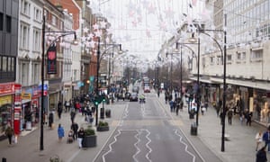 Shoppers in London on 22 December. The rise of the Omicron variant has seen quieter streets as people take precautions. The street is sparesely populated for the busy Christmas period.