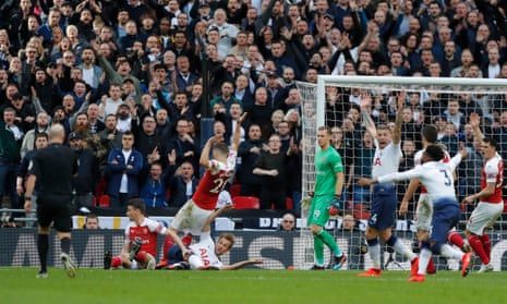 Tottenham’s Harry Kane is fouled by Arsenal’s Shkodran Mustafi resulting in a penalty.