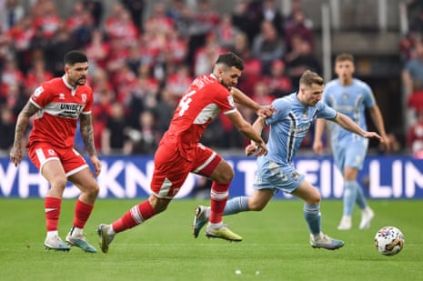Tommy Smith battles for the ball with Jamie Allen of Coventry City.