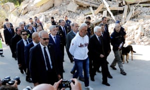 President Sergio Mattarella (centre) is shown the damage in Amatrice by the mayor Sergio Pirozzi (in white)