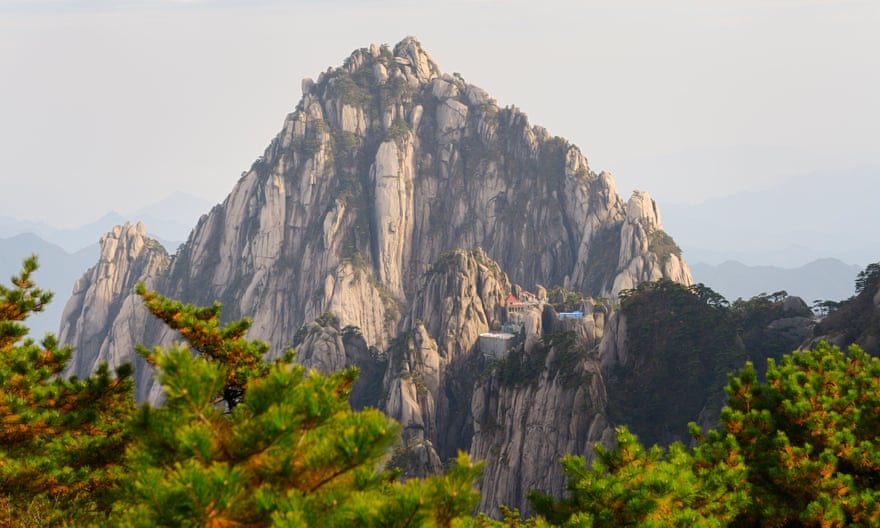 Jade Screen Tower with hotel and Heavenly City Peak from Brightness Top on Huangshan China