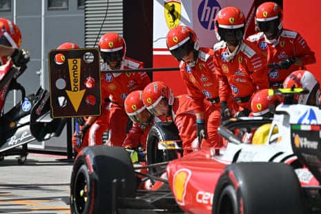 Ferrari's British driver Lewis Hamilton arrives for the first pit stop.