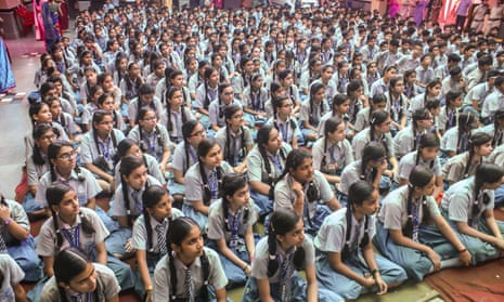 Girls listen to police officers talk about reporting sexual abuse, at a public school in Delhi.