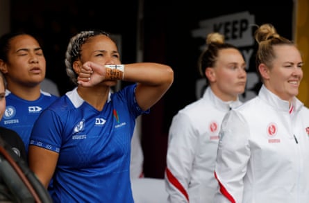 Sui Pauaraisa, the Samoa captain, kisses her wristband and says a prayer before exiting the tunnel with her team.