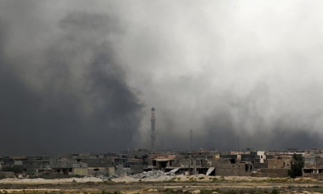 Smoke billows from Fallujah’s southern Shuhada neighbourhood following shelling.