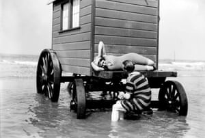 Swimmers on a bathing hut, about 1900.