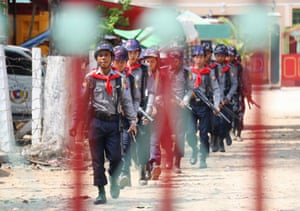 Armed police march to the entrance of Myitkyina prison, northern Myanmar