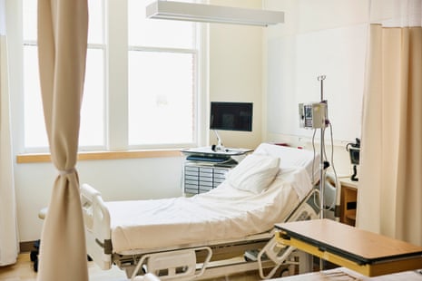Wide shot of empty hospital bed