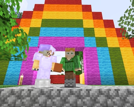 A rainbow created in Minecraft by Ellie Finch and her nieces and nephews with two children standing in front