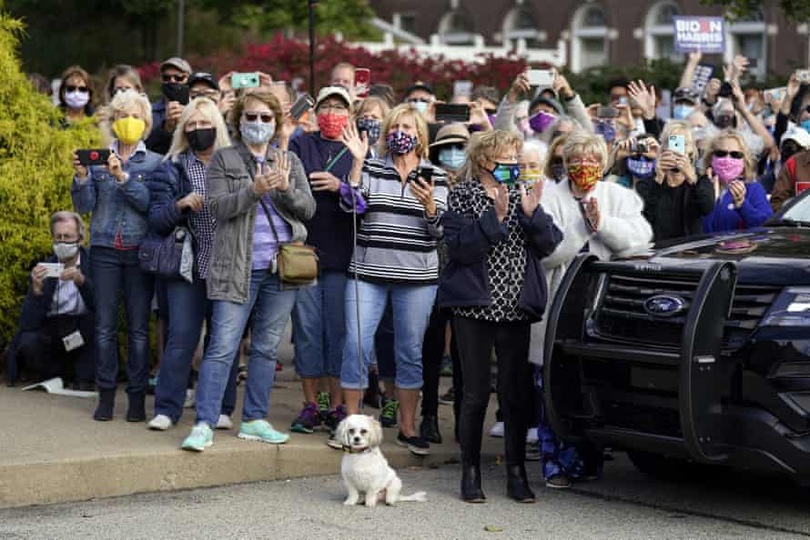 Supporters wave as Joe Biden completes a train tour through Ohio and Pennsylvania on Wednesday.
