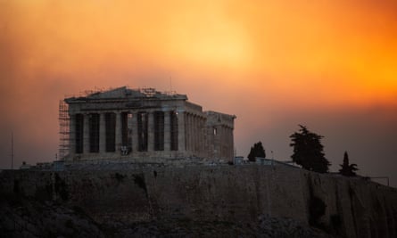 The Parthenon temple in Athens sits under cloud from the wildfire.