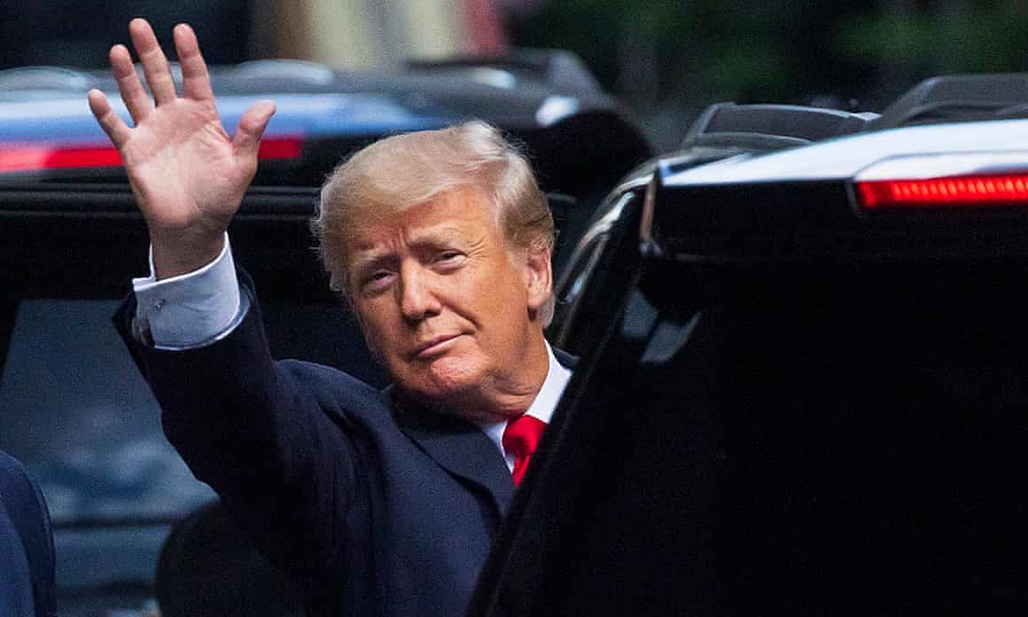 Donald Trump waving to pedestrians as he left Trump Tower on Tuesday.