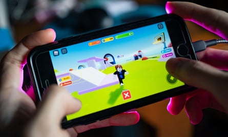 A Roblox game being played on an iPhone. Successful games can make developers rich.