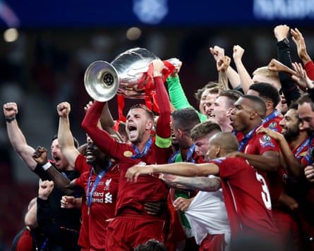 Jordan Henderson lifts the Champions League trophy after the final between Liverpool and Tottenham in 2019