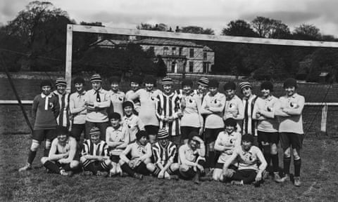 Members of Dick, Kerr Ladies and the France international team pose before their match in April 1920.