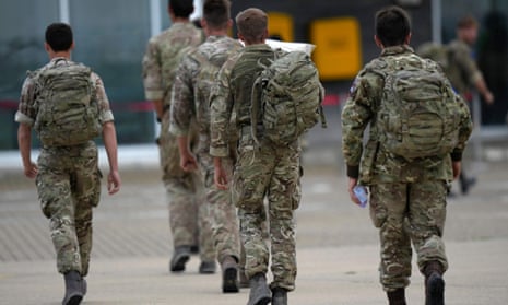 Members of 16 Air Assault Brigade walk to the air terminal at Brize Norton, Oxfordshire on 28 August after assisting with the evacuation from Kabul.