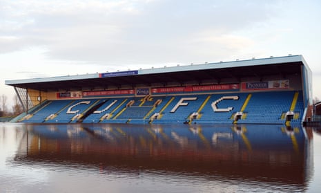 Flood water covers the pitch and some of the stands at Carlisle United FC’s Brunton Park stadium in Carlisle.