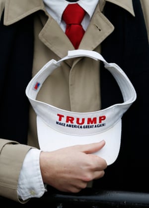 A man listens as Trump delivers his inaugural address after taking the oath of office