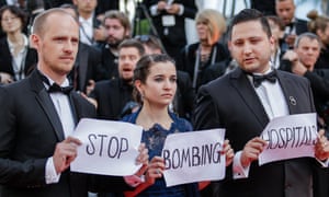 Co-director Edward Watts, Waad al-Kateab and her husband Hamza take their message to the Cannes film festival earlier this year.