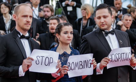 Co-director Edward Watts, Waad al-Kateab and her husband Hamza take their message to the Cannes film festival earlier this year.